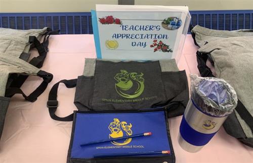 Backpack, pencils, pencil case and waterbottle given to teachers for appreciation